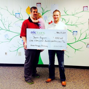 Shane Cyrus receives his award from NLC Loans CEO Jeremy Sopko. 