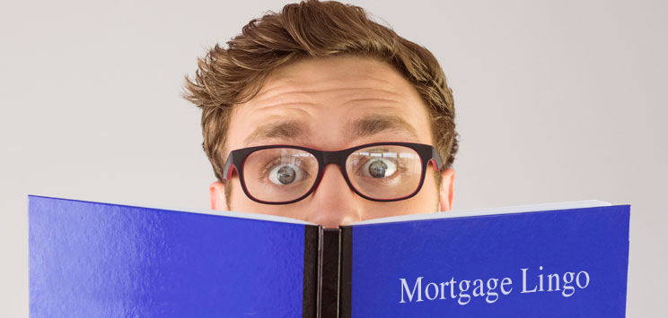 guy reading mortgage lingo book