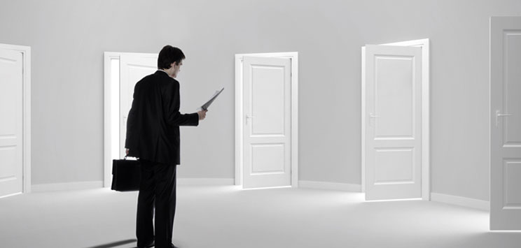 Man deciding which door to open