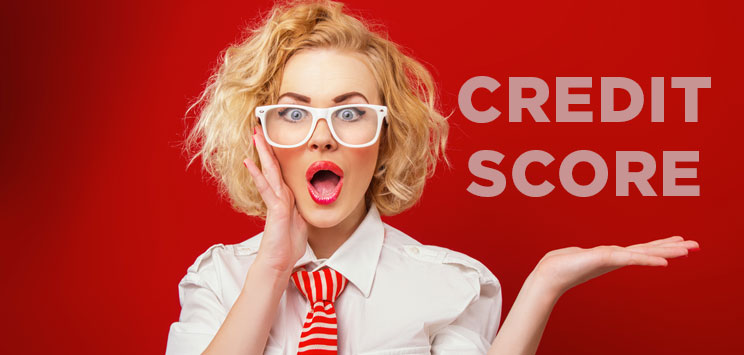 lady in glasses on red background with credit score